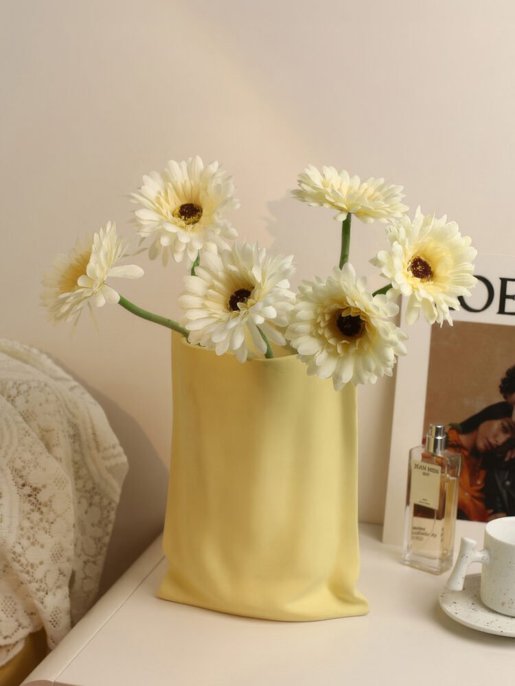 Hand-pinched aesthetic ceramic vase resembling a paper bag
