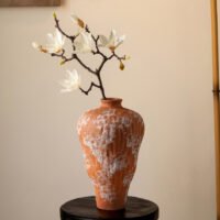 Vibrant orange irregular shaped modern ceramic vase