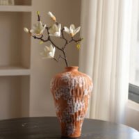 Vibrant orange irregular shaped modern ceramic vase