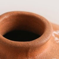 Vibrant orange irregular shaped modern ceramic vase