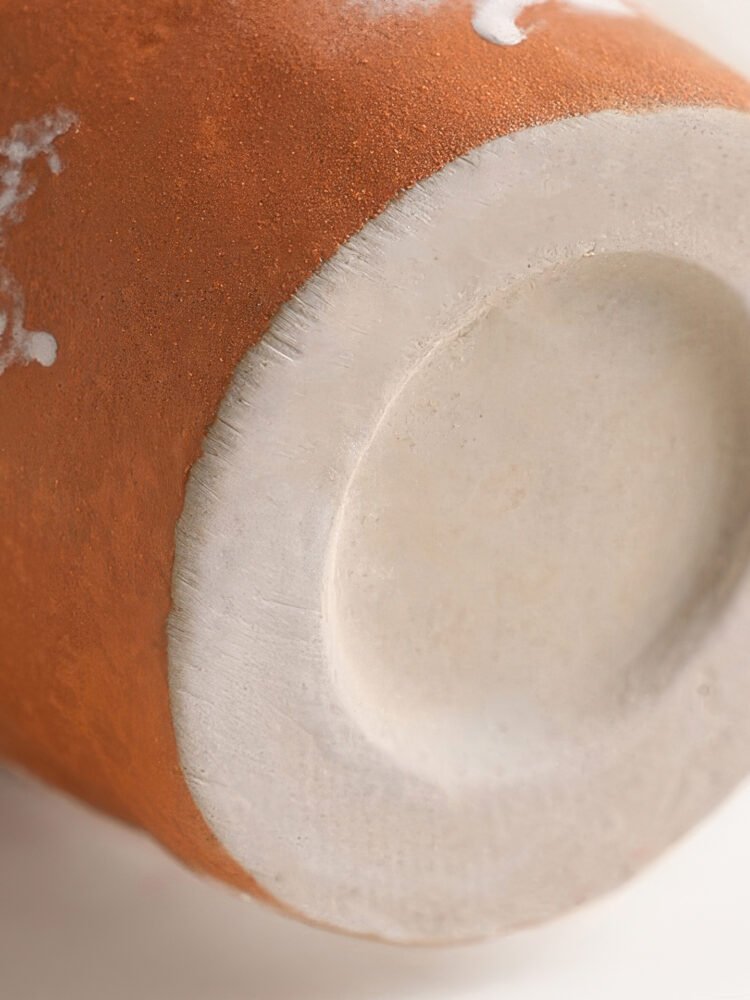 Vibrant orange irregular shaped modern ceramic vase