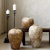 Vintage wabi-sabi style rustic pottery vase with weathered stone texture
