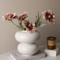 Minimalist hollow donut-shaped ceramic vase
