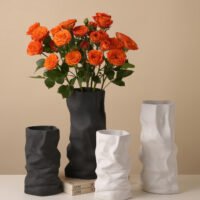 Creative ceramic vase mimicking crinkled kraft paper bag texture