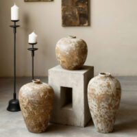 Vintage wabi-sabi style rustic pottery vase with weathered stone texture