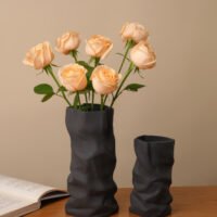 Creative ceramic vase mimicking crinkled kraft paper bag texture