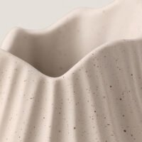 Wabi-sabi minimalist vase with irregular surface pattern