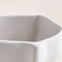 Creative ceramic vase mimicking crinkled kraft paper bag texture