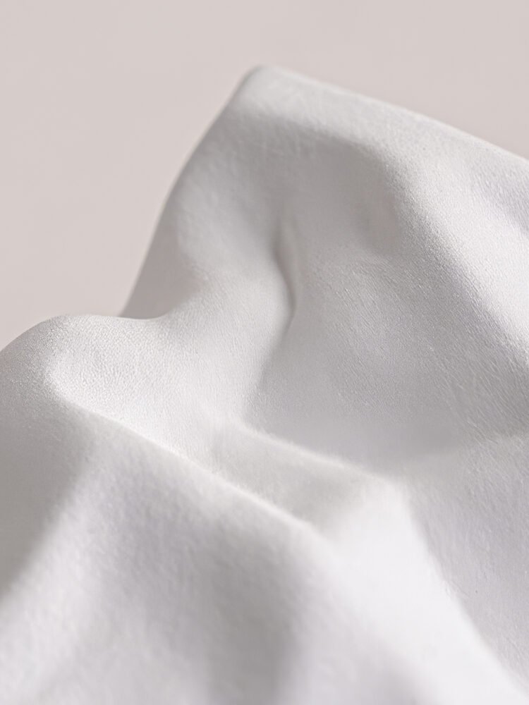 Creative ceramic vase mimicking crinkled kraft paper bag texture