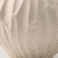 Wabi-sabi minimalist vase with irregular surface pattern