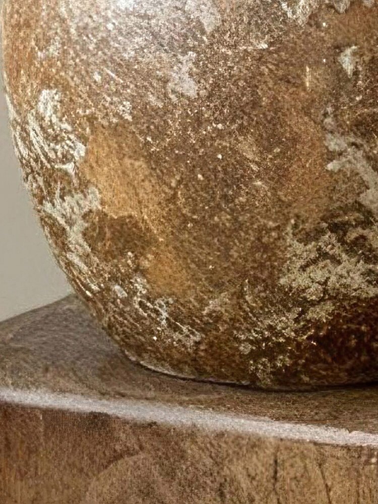 Vintage wabi-sabi style rustic pottery vase with weathered stone texture