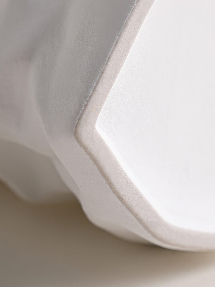 Creative ceramic vase mimicking crinkled kraft paper bag texture