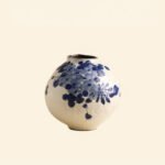 Classic blue-and-white porcelain vessel with delicate wisteria floral motif