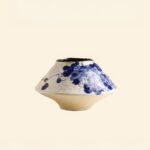 Classic blue-and-white porcelain vessel with delicate wisteria floral motif