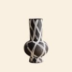 Wabiv modern ink-patterned striped ceramic vase in minimalist studio setting