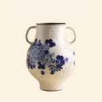 Classic blue-and-white porcelain vessel with delicate wisteria floral motif