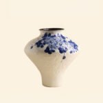Classic blue-and-white porcelain vessel with delicate wisteria floral motif