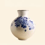 Classic blue-and-white porcelain vessel with delicate wisteria floral motif