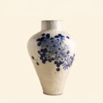 Classic blue-and-white porcelain vessel with delicate wisteria floral motif