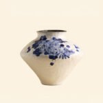 Classic blue-and-white porcelain vessel with delicate wisteria floral motif