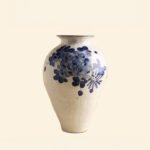 Classic blue-and-white porcelain vessel with delicate wisteria floral motif