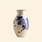 Classic blue-and-white porcelain vessel with delicate wisteria floral motif