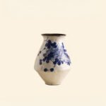 Classic blue-and-white porcelain vessel with delicate wisteria floral motif