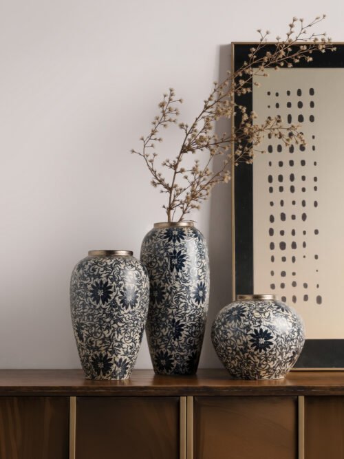 Vintage blue and white porcelain vessel with intricate vine motif pattern