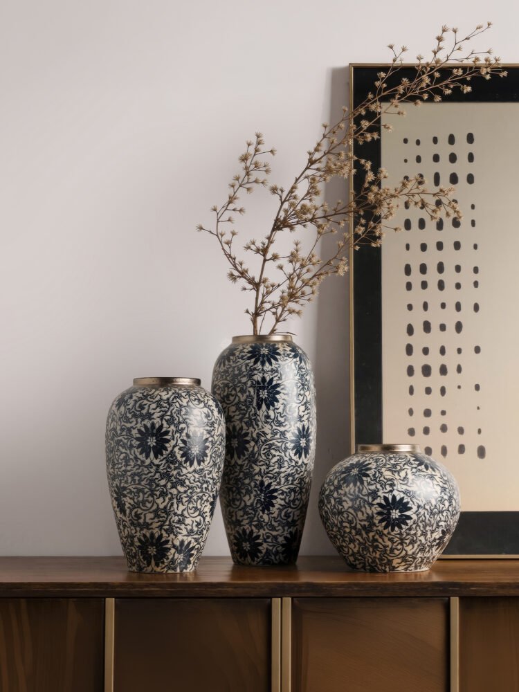 Vintage blue and white porcelain vessel with intricate vine motif pattern