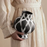 Wabiv modern ink-patterned striped ceramic vase in minimalist studio setting