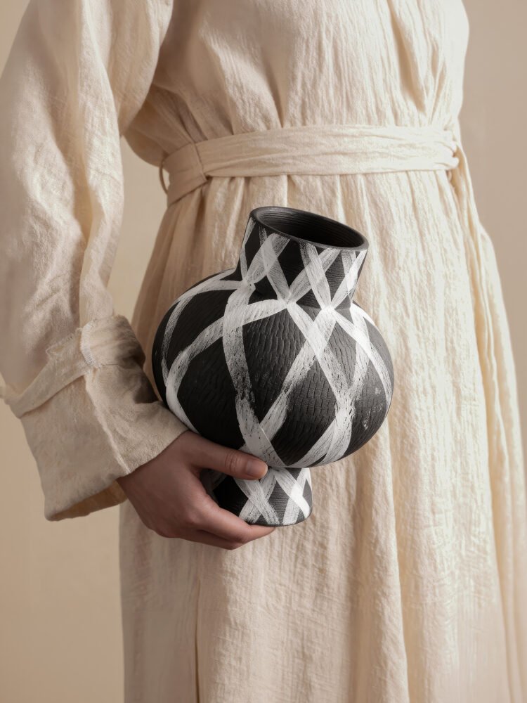 Wabiv modern ink-patterned striped ceramic vase in minimalist studio setting