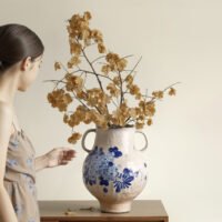 Classic blue-and-white porcelain vessel with delicate wisteria floral motif