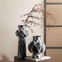 Wabiv modern ink-patterned striped ceramic vase in minimalist studio setting