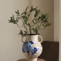 Classic blue-and-white porcelain vessel with delicate wisteria floral motif