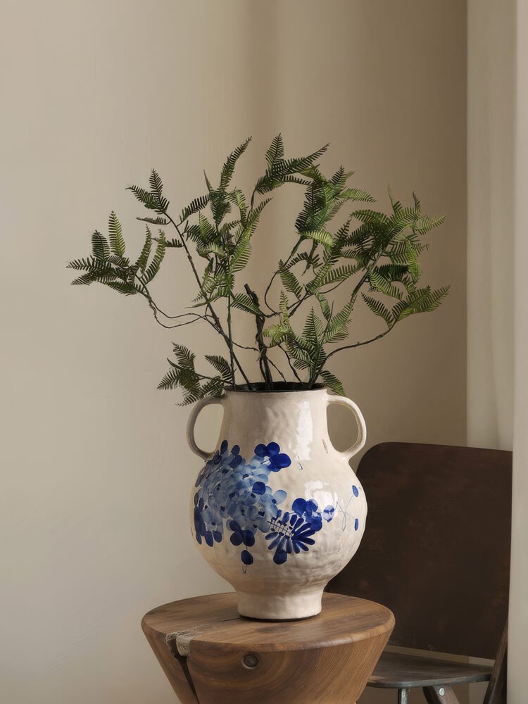 Classic blue-and-white porcelain vessel with delicate wisteria floral motif