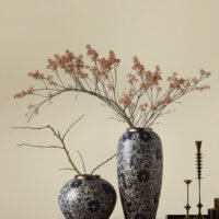 Vintage blue and white porcelain vessel with intricate vine motif pattern