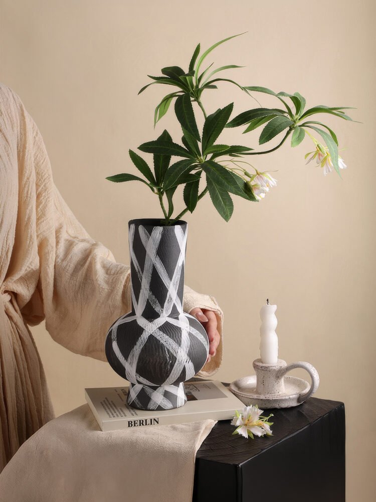 Wabiv modern ink-patterned striped ceramic vase in minimalist studio setting