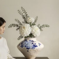 Classic blue-and-white porcelain vessel with delicate wisteria floral motif