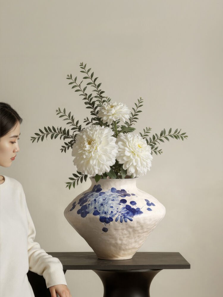 Classic blue-and-white porcelain vessel with delicate wisteria floral motif