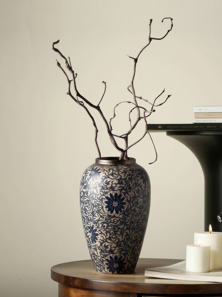 Vintage blue and white porcelain vessel with intricate vine motif pattern