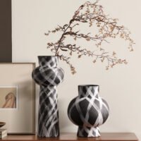 Wabiv modern ink-patterned striped ceramic vase in minimalist studio setting