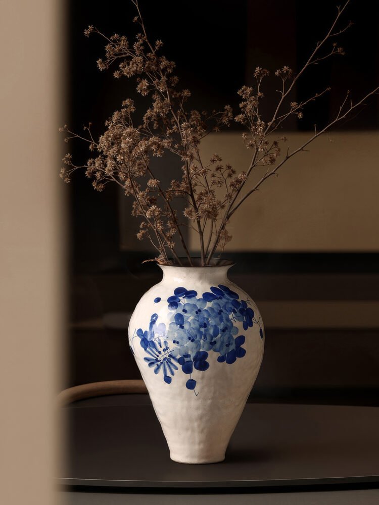 Classic blue-and-white porcelain vessel with delicate wisteria floral motif
