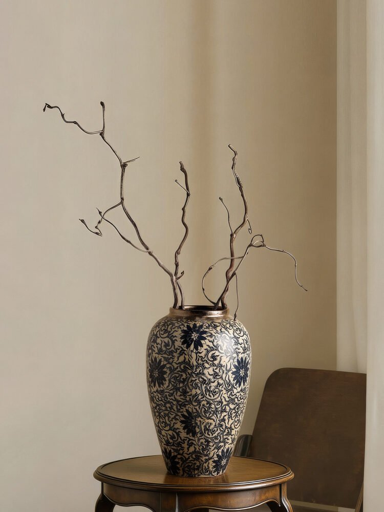 Vintage blue and white porcelain vessel with intricate vine motif pattern