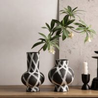 Wabiv modern ink-patterned striped ceramic vase in minimalist studio setting