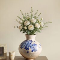 Classic blue-and-white porcelain vessel with delicate wisteria floral motif