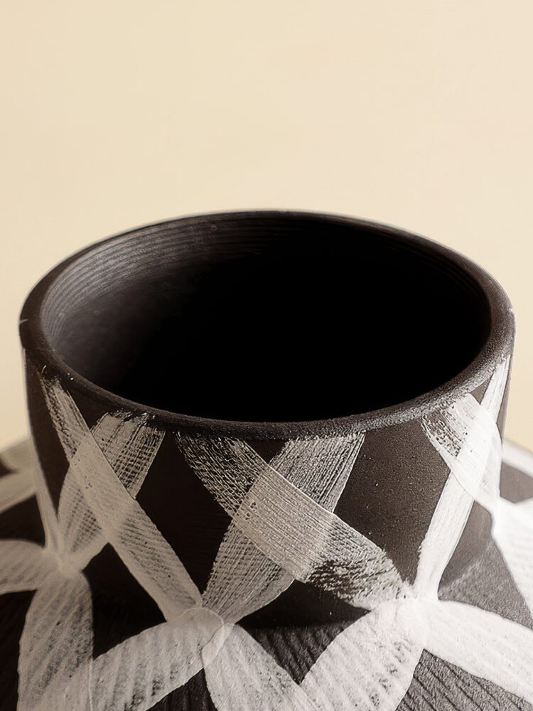 Wabiv modern ink-patterned striped ceramic vase in minimalist studio setting