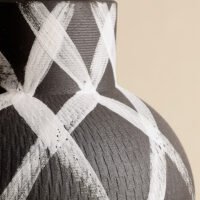 Wabiv modern ink-patterned striped ceramic vase in minimalist studio setting