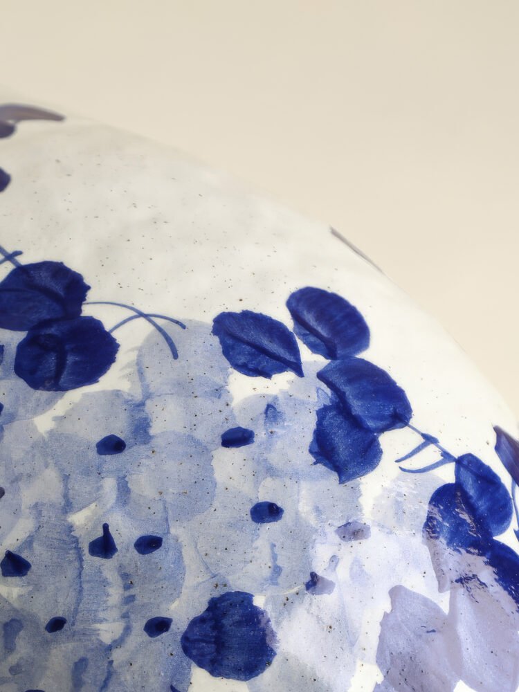 Classic blue-and-white porcelain vessel with delicate wisteria floral motif