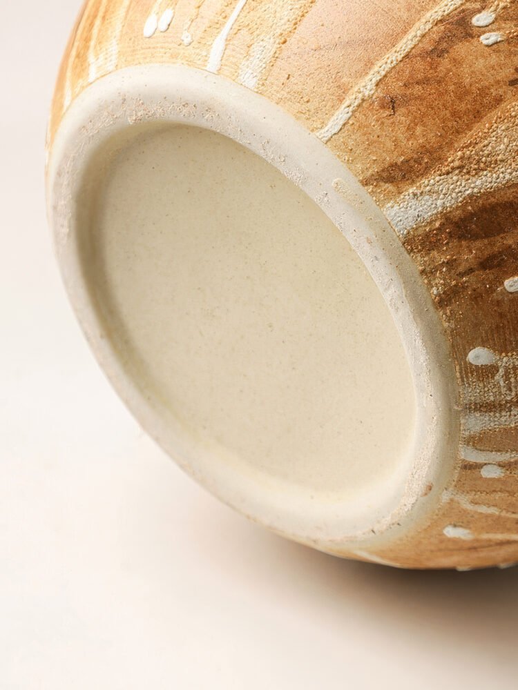 Wabiv rustic unadorned ceramic vessel with weathered traces for wabi-sabi home decor