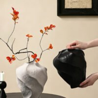 Modern mountain spiral sculptural ceramic art vase in matte obsidian black and marble white
